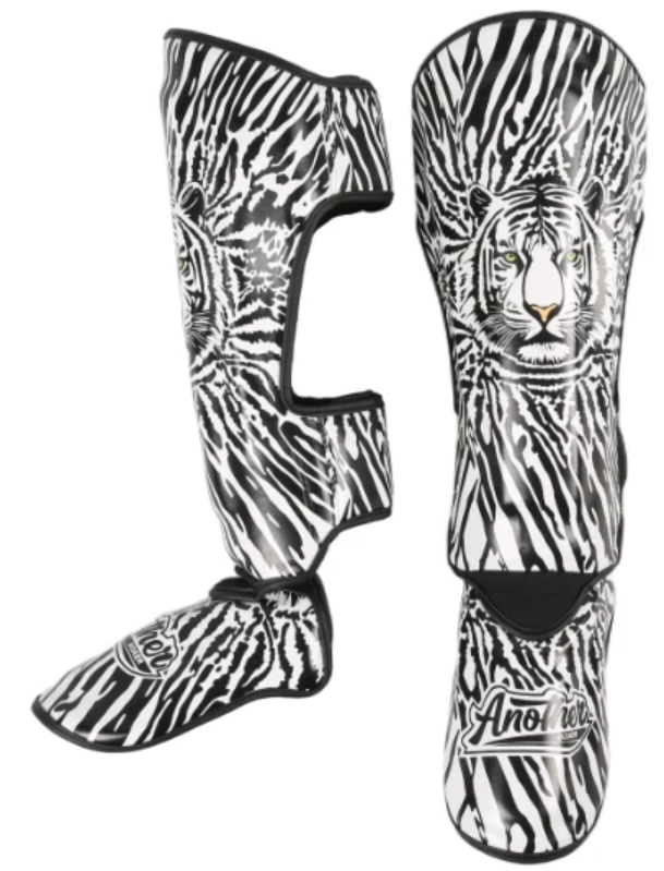 Espinilleras (Versace Lion)